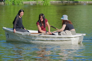Three young women in a boat